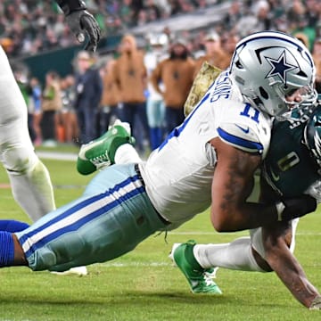 Nov 5, 2023; Philadelphia, Pennsylvania, USA; Dallas Cowboys linebacker Micah Parsons (11) stops Philadelphia Eagles running back D'Andre Swift (0) short of the goal line during the second quarter at Lincoln Financial Field. Mandatory Credit: Eric Hartline-Imagn Images