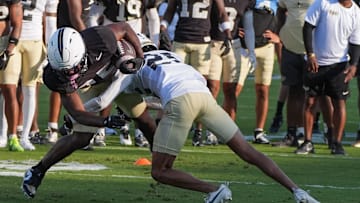 UCF running back Agyeman Addae competes with Rukeem Stroud during UCF Spring football practice at FBC Mortgage Stadium in Orlando, Friday, April 11, 2025.