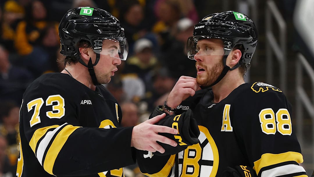 Mar 24, 2026; Boston, Massachusetts, USA; Boston Bruins defenseman Charlie McAvoy (73) talks with right wing David Pastrnak (88) during the third period against the Toronto Maple Leafs at TD Garden. Mandatory Credit: Winslow Townson-Imagn Images