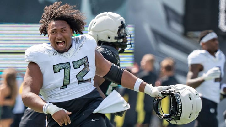Fighting Ducks offensive lineman Iapani Laloulu celebrates as the Fighting Ducks face off against Mighty Oregon in the Oregon Ducks spring game on April 26, 2025, at Autzen Stadium in Eugene. Fighting Ducks offensive lineman Iapani Laloulu celebrates as the Fighting Ducks face off against Mighty Oregon in the Oregon Ducks spring game on April 26, 2025, at Autzen Stadium in Eugene.