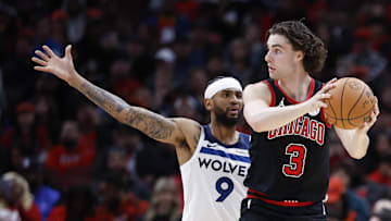 Nov 7, 2024; Chicago, Illinois, USA; Chicago Bulls guard Josh Giddey (3) looks to pass against Minnesota Timberwolves guard Nickeil Alexander-Walker (9) during the first half at United Center. Mandatory Credit: Kamil Krzaczynski-Imagn Images