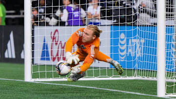 Aug 20, 2025; Seattle, Washington, USA; Seattle Sounders FC goalkeeper Andrew Thomas (26) blocks a goal shot during the shootout against Puebla at Lumen Field. Mandatory Credit: Steven Bisig-Imagn Images