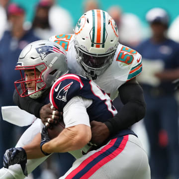 Oct 29, 2023; Miami Gardens, Florida, USA; Miami Dolphins linebacker Jerome Baker (55) tackles New England Patriots tight end Mike Gesicki (88) during the second half at Hard Rock Stadium. Mandatory Credit: Jasen Vinlove-USA TODAY Sports