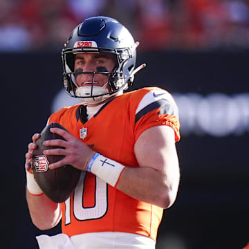 Nov 16, 2025; Denver, Colorado, USA;  Denver Broncos quarterback Bo Nix (10) looks to pass during the first quarter of the game against the Kansas City Chiefs at Empower Field at Mile High. Mandatory Credit: Ron Chenoy-Imagn Images