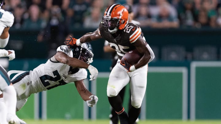 Aug 17, 2023; Philadelphia, Pennsylvania, USA; Cleveland Browns running back Demetric Felton Jr. (25) breaks the tackle attempt of Philadelphia Eagles cornerback Zech McPhearson (27) during the second quarter at Lincoln Financial Field. Mandatory Credit: Bill Streicher-USA TODAY Sports