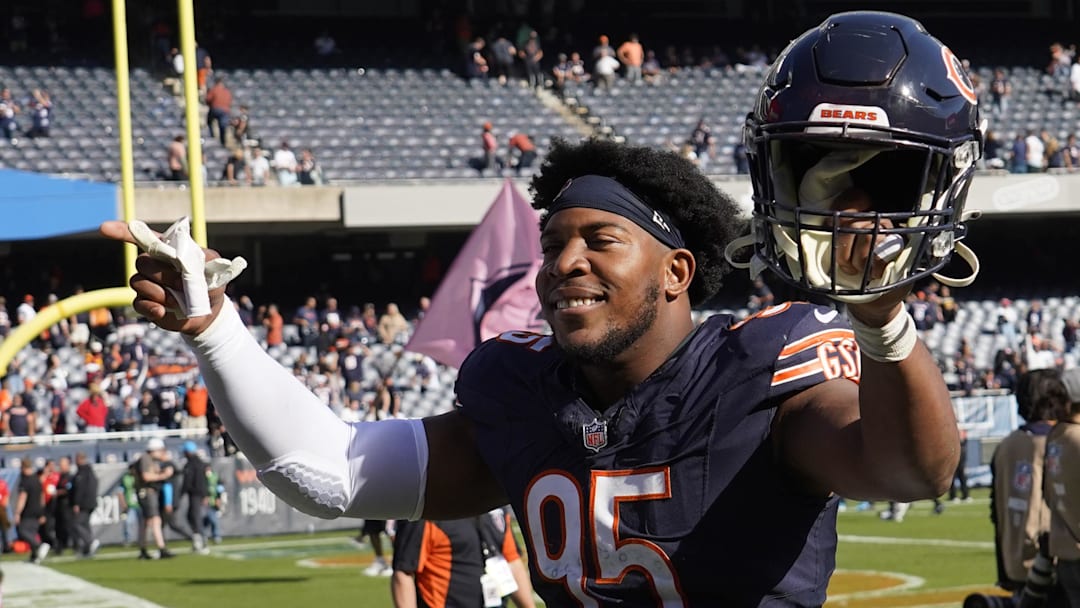 Chicago Bears defensive end DeMarcus Walker (95) gestures to the crowd after the game against the Carolina Panthers at Soldier Field.