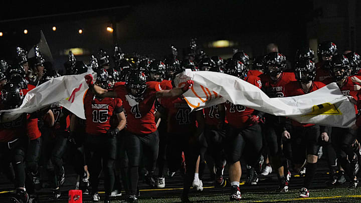 Gilbert football team enters the field before the game against North Polk in the week-9 Iowa high school football at Tigers Stadium on Oct.24, 2025, in Gilbert, Iowa.
