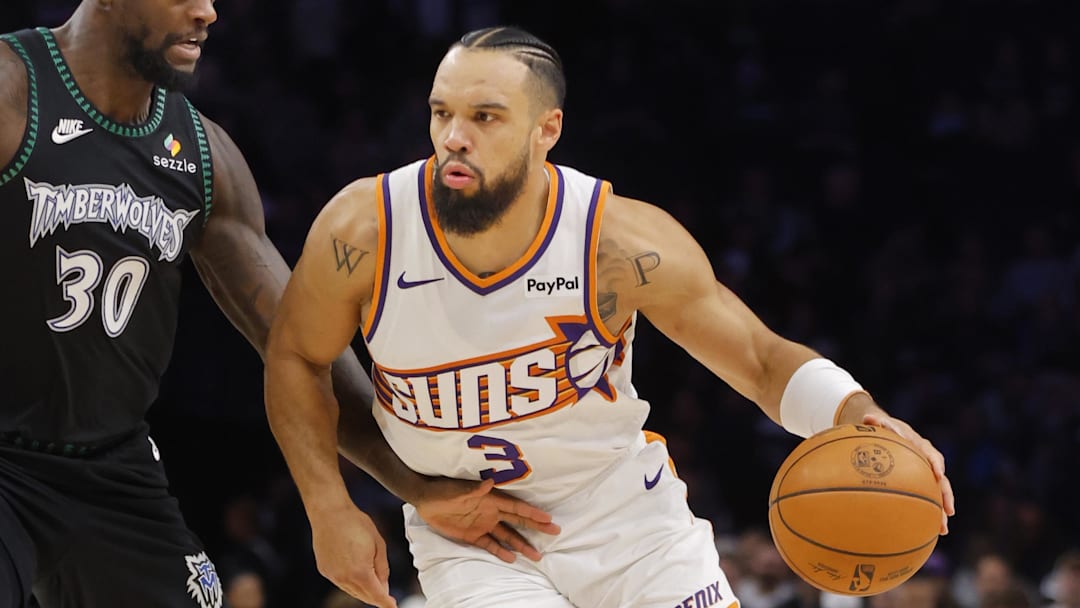 Dec 8, 2025; Minneapolis, Minnesota, USA; Phoenix Suns forward Dillon Brooks (3) works around Minnesota Timberwolves forward Julius Randle (30) in the first quarter at Target Center. Mandatory Credit: Bruce Kluckhohn-Imagn Images