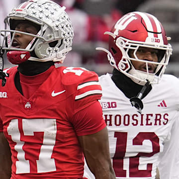 Ohio State Buckeyes wide receiver Carnell Tate (17) celebrates a first down catch beside Indiana Hoosiers defensive back Terry Jones Jr. (12) during the NCAA football game at Ohio Stadium in Columbus on Monday, Nov. 25, 2024. Ohio State won 38-15.