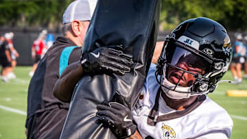 Jacksonville Jaguars cornerback Aydan White (40) wraps up a tackling dummy during the seventh organized team activity at the Miller Electric Center in Jacksonville, Fla. Monday, June 2, 2025.