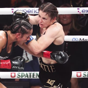 Amanda Serrano and Katie Taylor compete in a boxing match.