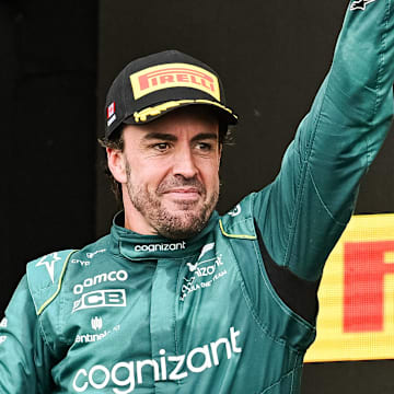 Jun 18, 2023; Montreal, Quebec, CAN; Aston Martin driver Fernando Alonso (ESP) sows pride after receiving his second place trophy of the Canadian Grand Prix at Circuit Gilles Villeneuve. Mandatory Credit: David Kirouac-Imagn Images