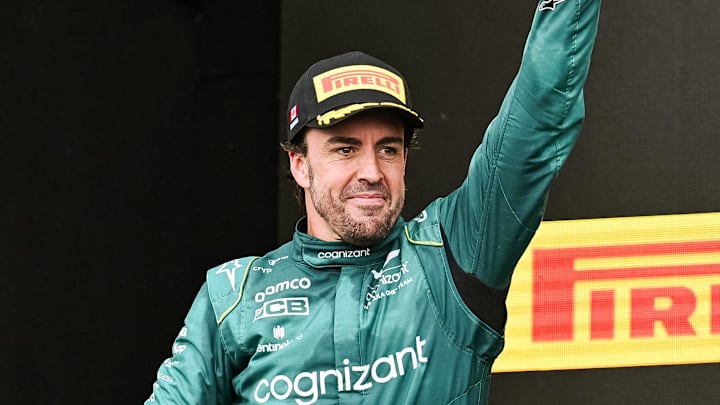 Jun 18, 2023; Montreal, Quebec, CAN; Aston Martin driver Fernando Alonso (ESP) sows pride after receiving his second place trophy of the Canadian Grand Prix at Circuit Gilles Villeneuve. Mandatory Credit: David Kirouac-Imagn Images