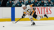 Jan 27, 2025; San Jose, California, USA;  Pittsburgh Penguins defenseman Erik Karlsson (65) takes a shot on goal during the third period against the San Jose Sharks at SAP Center at San Jose. Mandatory Credit: David Gonzales-Imagn Images