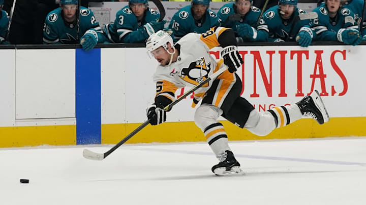 Jan 27, 2025; San Jose, California, USA;  Pittsburgh Penguins defenseman Erik Karlsson (65) takes a shot on goal during the third period against the San Jose Sharks at SAP Center at San Jose. Mandatory Credit: David Gonzales-Imagn Images