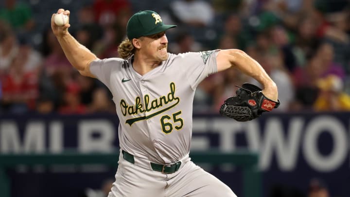 Jul 25, 2024; Anaheim, California, USA;  Oakland Athletics relief pitcher Tyler Ferguson (65) pitches during the ninth inning against the Los Angeles Angels at Angel Stadium. Mandatory Credit: Kiyoshi Mio-USA TODAY Sports