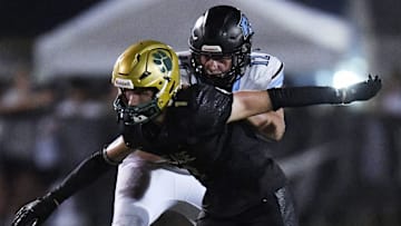 Ponte Vedra Sharks Caleb Stanton (12) tries to control Nease Panthers Jacob Curry (1) during late third quarter action. The Nease Panthers hosted the Ponte Vedra Sharks in High School Football Friday evening, August 23, 2024. The Panthers were the 24 to 7 victors over the Sharks.