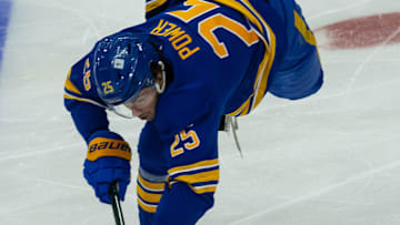 Jan 9, 2025; Ottawa, Ontario, CAN; Buffalo Sabres defenseman Owen Power (25) reaches for the puck in the third pepriod against the Ottawa Senators at the Canadian Tire Centre. Mandatory Credit: Marc DesRosiers-Imagn Images