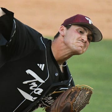 Troy University relief pitcher Zach Fruit delivers a pitch against Boston College at Sewell-Thomas Stadium in Tuscaloosa.