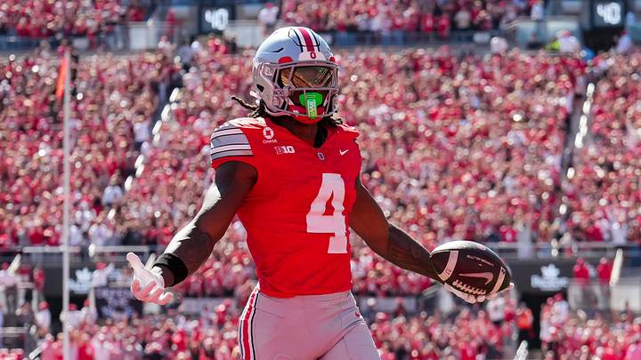 Ohio State Buckeyes wide receiver Jeremiah Smith (4) scores a touchdown during the NCAA football game against the Illinois Fighting Illini at Ohio Stadium in Columbus on Sept. 26, 2026.
