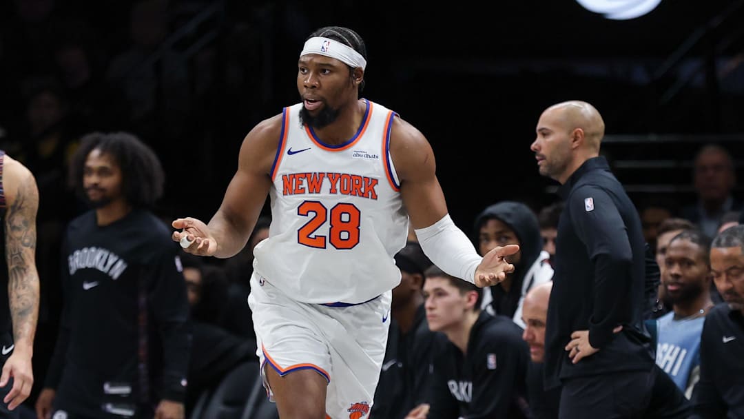Nov 24, 2025; Brooklyn, New York, USA; New York Knicks forward Guerschon Yabusele (28) reacts in front of Brooklyn Nets guard Tyrese Martin (13) during the second half at Barclays Center. Mandatory Credit: Vincent Carchietta-Imagn Images