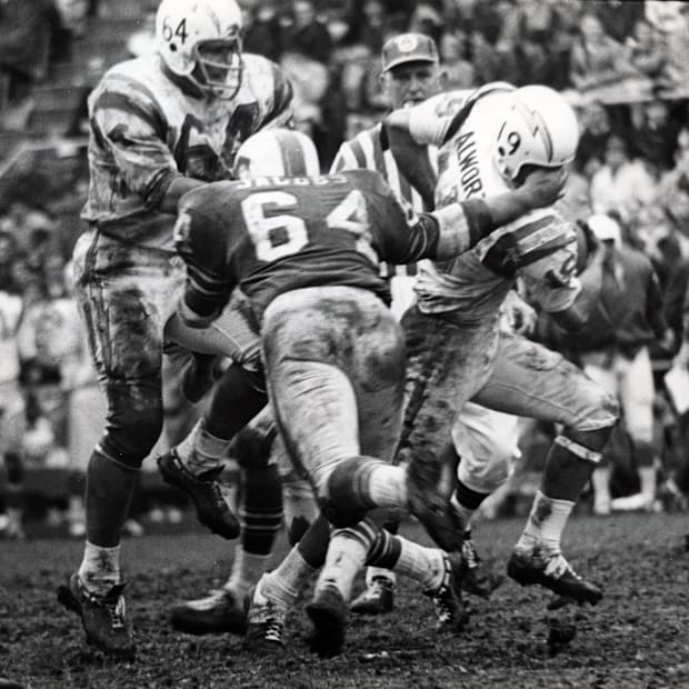 Former Buffalo Bills linebacker Harry Jacobs tackles Chargers Lance Alworth.