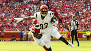 Sep 15, 2024; Kansas City, Missouri, USA; Cincinnati Bengals tight end Erick All Jr. (83) is tackled by Kansas City Chiefs linebacker Nick Bolton (32) during the first half at GEHA Field at Arrowhead Stadium. Mandatory Credit: Jay Biggerstaff-Imagn Images