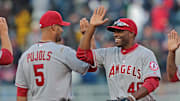 Apr 9, 2012; Minneapolis, MN, USA: Los Angeles Angels right fielder Torii Hunter (48) celebrates with first baseman Albert Pujols (5) after beating the Minnesota Twins at Target Field. The Angels won 5-1. Mandatory Credit: Jesse Johnson-Imagn Images