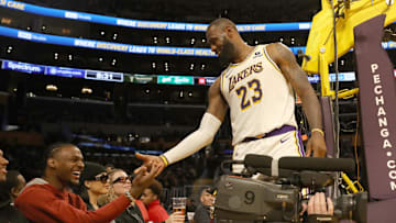 Nov 19, 2023; Los Angeles, California, USA;  Los Angeles Lakers forward LeBron James (23) shakes hands with his son Bronny James during the second half against the Houston Rockets at Crypto.com Arena. Mandatory Credit: Kiyoshi Mio-Imagn Images
