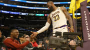 Nov 19, 2023; Los Angeles, California, USA;  Los Angeles Lakers forward LeBron James (23) daps up son Bronny James.