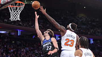 Nov 12, 2025; New York, New York, USA;  Orlando Magic forward Franz Wagner (22) drives past New York Knicks center Mitchell Robinson (23) in the third quarter at Madison Square Garden. Mandatory Credit: Wendell Cruz-Imagn Images