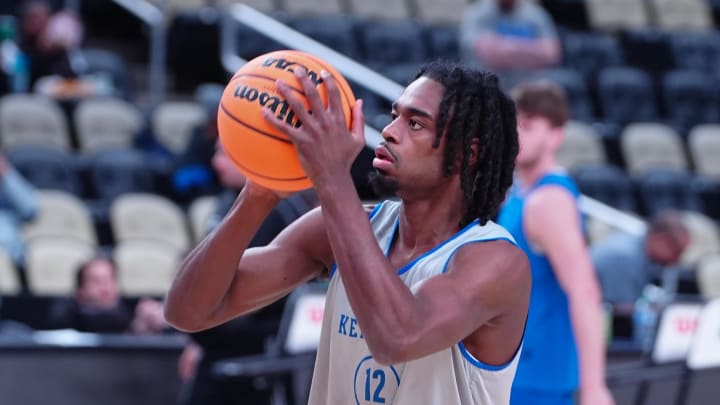 Mar 20, 2024; Pittsburgh, PA, USA; Kentucky Wildcats guard Antonio Reeves (12) shoots the ball during the NCAA first round practice session at PPG Paints Arena. Mandatory Credit: Gregory Fisher-USA TODAY Sports