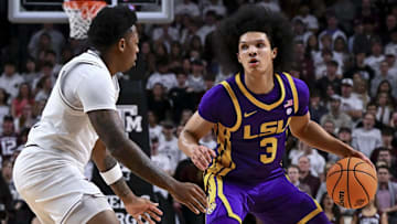 Jan 18, 2025; College Station, Texas, USA; LSU Tigers guard Curtis Givens III (3) drives against Texas A&M Aggies guard Wade Taylor IV (4) during the second half at Reed Arena. The Aggies defeated the Tigers 68-57. Mandatory Credit: Maria Lysaker-Imagn Images 