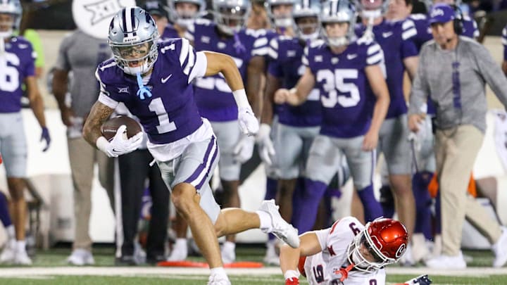 Sep 13, 2024; Manhattan, Kansas, USA; Kansas State Wildcats wide receiver Jayce Brown (1) breaks a by Arizona Wildcats defensive back Gunner Maldonado (9) during the third quarter at Bill Snyder Family Football Stadium. Mandatory Credit: Scott Sewell-Imagn Images