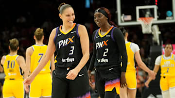 Mercury guard Diana Taurasi laughs with guard Kahleah Copper during a game against the Sparks.