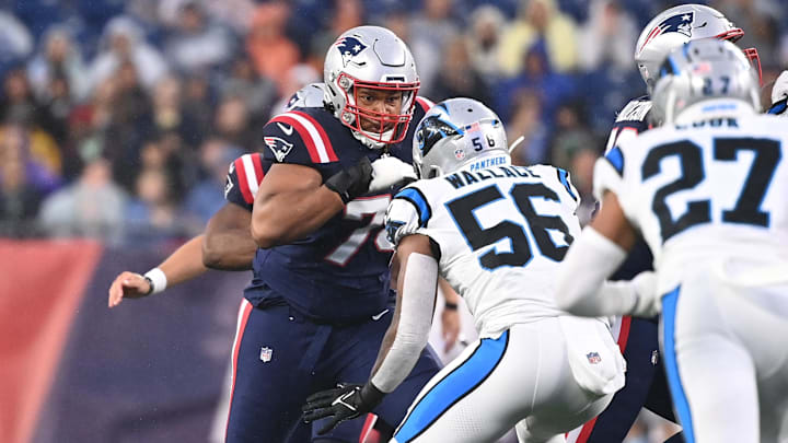 August 8, 2024; Foxborough, MA, USA;  New England Patriots guard Michael Jordan (74) blocks Carolina Panthers linebacker Trevin Wallace (56) during the first half at Gillette Stadium. Mandatory Credit: Eric Canha-Imagn Images