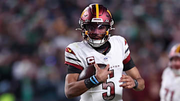 Jan 26, 2025; Philadelphia, PA, USA; Washington Commanders quarterback Jayden Daniels (5) runs with the ball
