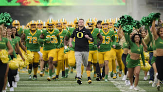 Nov 9, 2024; Eugene, Oregon, USA; Oregon Ducks head coach Dan Lanning leads his team before the start of a game against the Maryland Terrapins at Autzen Stadium. Mandatory Credit: Troy Wayrynen-Imagn Images