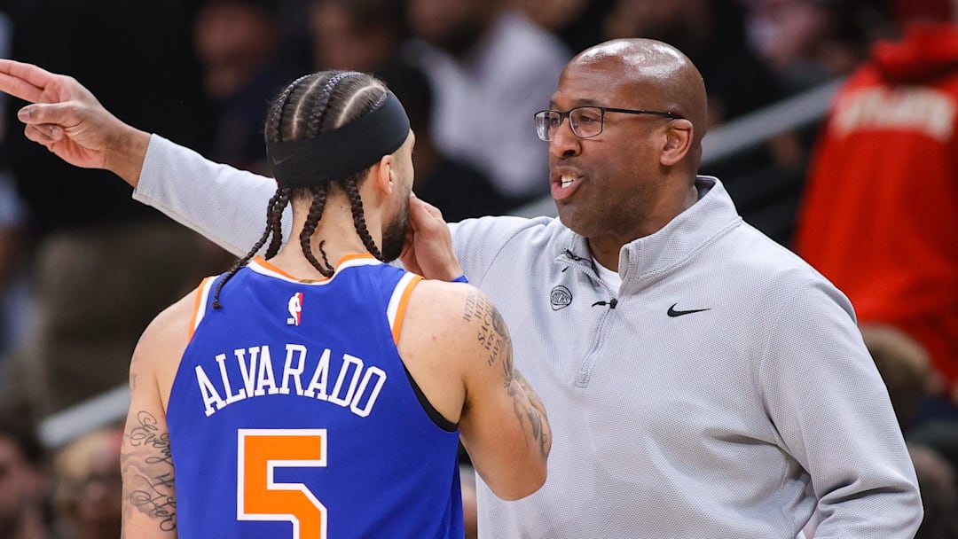 New York Knicks head coach Mike Brown talks to guard Jose Alvarado (5) against the Atlanta Hawks in the second quarter during game six of the first round of the 2026 NBA Playoffs at State Farm Arena.