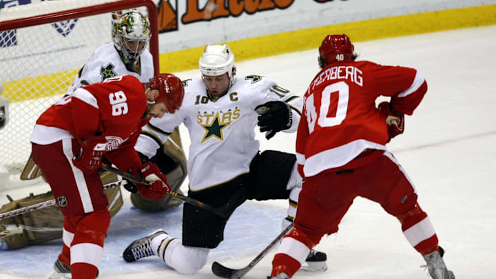May 17, 2008; Detroit, MI, USA; Detroit Red Wings right wing Tomas Holmstrom (96) and left wing Henrik Zetterberg (40) look for the rebound against Dallas Stars left wing Brenden Morrow (10) and goalie Marty Turco (35) during the first period of game five of the Western Conference finals at Joe Louis Arena. Mandatory Credit: Leon Halip-Imagn Images