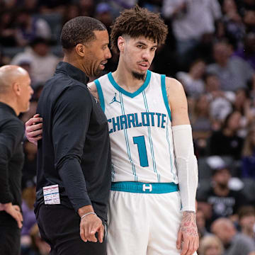 Feb 24, 2025; Sacramento, California, USA; Charlotte Hornets head coach Charles Lee talks with guard LaMelo Ball (1) during a time out in the fourth quarter of the game against the Sacramento Kings at Golden 1 Center. Mandatory Credit: Ed Szczepanski-Imagn Images