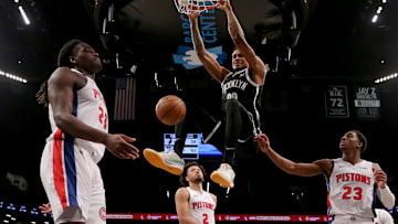 Dec 23, 2023; Brooklyn, New York, USA; Brooklyn Nets center Nic Claxton (33) hangs on the rim 