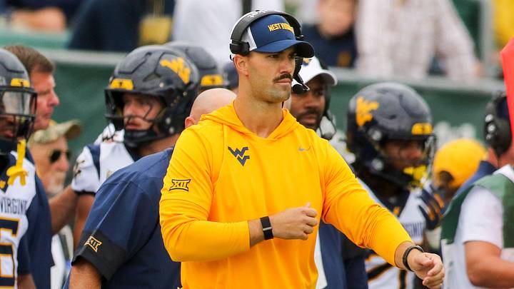 Sep 6, 2025; Athens, Ohio, USA; West Virginia Mountaineers defensive coordinator Zac Alley calls out plays from the sidelines during the first quarter against the West Virginia Mountaineers at Peden Stadium. Mandatory Credit: Ben Queen-Imagn Images