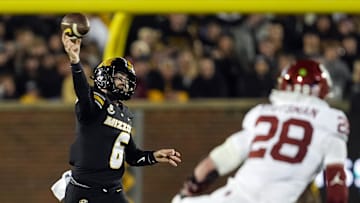 Nov 9, 2024; Columbia, Missouri, USA; Missouri Tigers quarterback Drew Pyne (6) throws a pass against Oklahoma Sooners linebacker Danny Stutsman (28) during the first half at Faurot Field at Memorial Stadium. Mandatory Credit: Jay Biggerstaff-Imagn Images