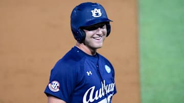 Auburn Tigers' Ike Irish (18) jokes with the dugout