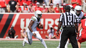Sep 7, 2024; Salt Lake City, Utah, USA; Baylor Bears quarterback Dequan Finn (7) runs the ball against the Utah Utes during the second quarter at Rice-Eccles Stadium. Mandatory Credit: Rob Gray-Imagn Images