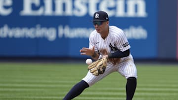 Jul 13, 2025; Bronx, New York, USA; New York Yankees shortstop Anthony Volpe (11) fields a ground ball hit by Chicago Cubs third baseman Matt Shaw (6) (not pictured) during the eighth inning at Yankee Stadium. Mandatory Credit: Gregory Fisher-Imagn Images