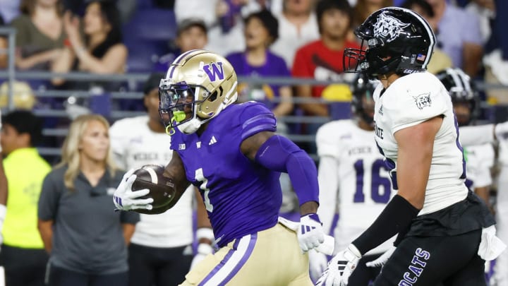 Running back Jonah Coleman (1) breaks into the clear against Weber State in the first quarter.