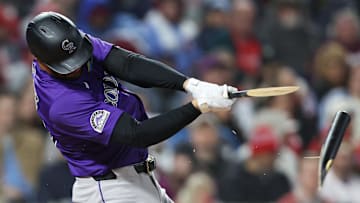 Apr 2, 2025; Philadelphia, Pennsylvania, USA; Colorado Rockies outfielder Kris Bryant (23) breaks his bat while hitting a single during the fifth inning against the Philadelphia Phillies at Citizens Bank Park. Mandatory Credit: Bill Streicher-Imagn Images