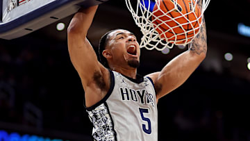 Feb 19, 2025; Washington, District of Columbia, USA; Georgetown Hoyas guard Micah Peavy (5) dunks during the first half against the Providence Friars at Capital One Arena. Mandatory Credit: Daniel Kucin Jr.-Imagn Images